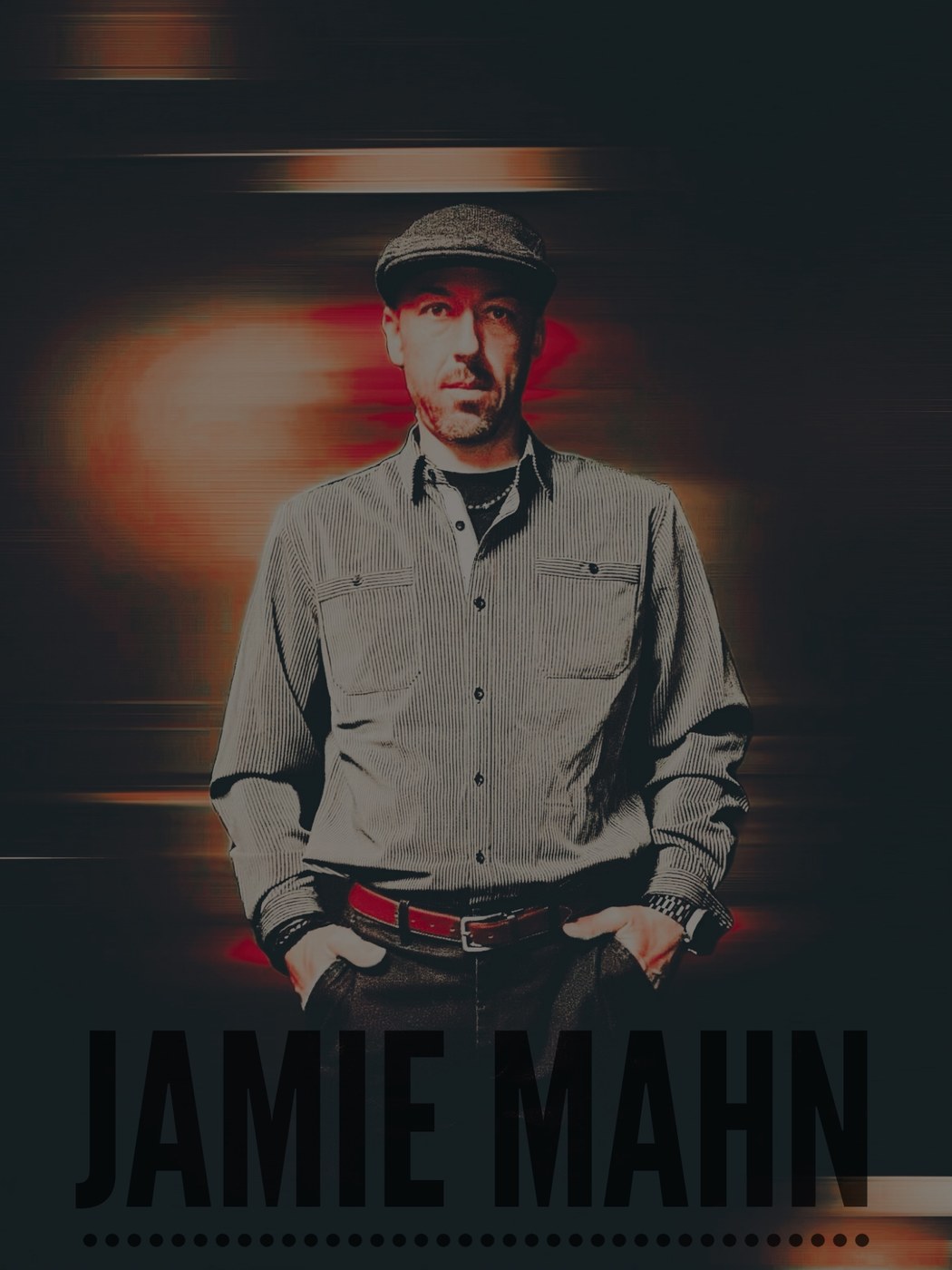 Studio portrait of Jamie Mahn in his signature flat cap.